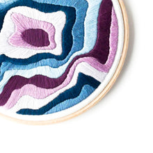 Load image into Gallery viewer, Detail section of mountain topography embroidered using satin stitch
